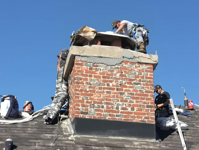 Fort Carson Chimney Sweep installing a custom chimney crown in Fort Carson, CO