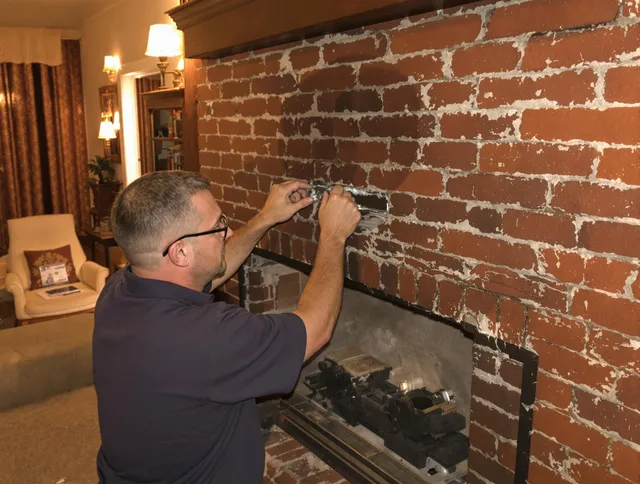 Fort Carson Chimney Sweep expert fixing a fireplace in Fort Carson, CO